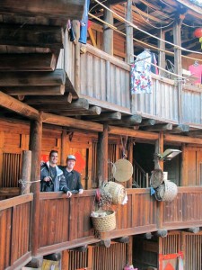 Bashers Tourists inside a Tulou house.